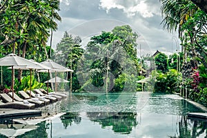 Luxury swimming pool at villa of tropical Bali island, Indonesia.