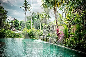 Luxury swimming pool at villa of tropical Bali island, Indonesia.