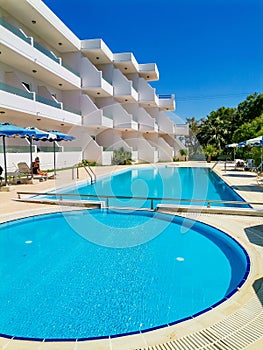 Luxury swimming pools in a modern hotel sunny day Greece Rhodos