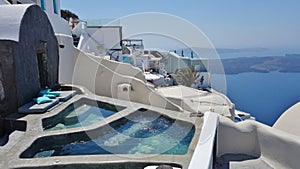 Luxury swimming pools in Santorini, Greece photo