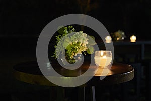 Luxury table flower decoration wedding event party at night, coctel table with candles photo
