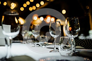 LUXURY TABLE SETTINGS 2019 for fine dining with and glassware, beautiful blurred background. For events, weddings. Preparation f