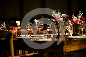 Luxury table settings for fine dining with and glassware, beautiful blurred background. For events, weddings.