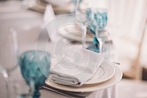 luxury tableware beautiful table setting in restaurant. The served table in the luxury restaurant. Beautiful evening restaurant