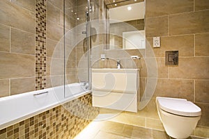 Luxury three piece bathroom in beige - brown