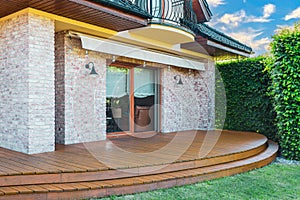Luxury villa exterior with garden terrace photo