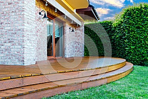 Luxury villa exterior with garden terrace photo
