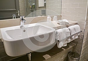 Luxury wash ceramic basin and towel in bathroom hotel