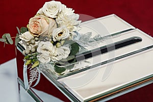 Luxury wedding gift box with roses and expensive golden decor ar