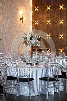 Luxury wedding table setting with flower centerpieces and candles