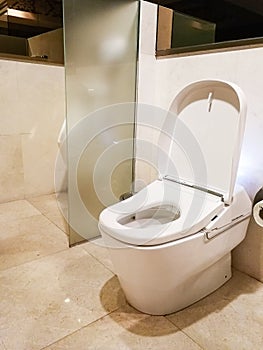 Luxury white ceramic flush toilet modern technology in restroom