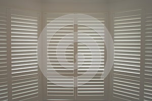 Luxury white indoor plantation shutters, closed shutters