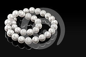 Luxury white pearl necklace on a black background with glossy reflection