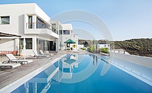 Luxury white villa with swimming pool photo