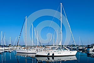 Luxury white yachts and boats moored in harbour