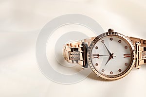 Luxury wrist watch on white background, closeup. Space for text