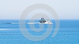 Luxury yacht cruising at open sea. View of luxury yacht cruising in turquoise lagoon. Sea recreation and entertainment