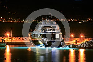 Luxury yacht moored on pier night