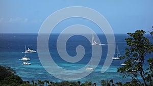 A luxury yacht sailing into admiral bay in the windward islands