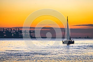 Luxury yacht Sailing on Tagus river at sunset