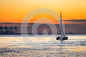 Luxury yacht Sailing on Tagus river at sunset