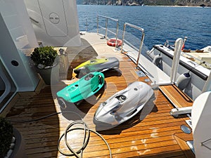 Luxury yacht toys, seabob, paddle board on aft deck of huge motor boat