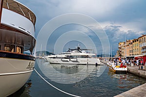 Luxury Yachts in the harbor of Saint Tropez - ST TROPEZ, FRANCE - JULY 13, 2020