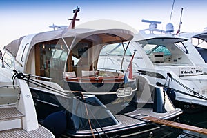 Luxury yachts moored in the marina.