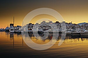 Luxury yachts and motor boats moored in Puerto Banus marina in Marbella, Spain