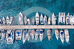 Luxury yachts and sailing boats to a marina in Greece photo