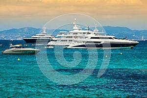 Luxury yachts in turquoise beach of Formentera Illetes