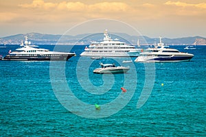 Luxury yachts in turquoise beach of Formentera Illetes