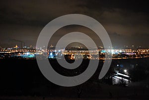 Luzhniki stadium on Luzhnetskaya embankment on a winter night. View from Sparrow hills. Winter night cityscape.