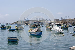 Luzzu boats on harbour, Marsaxlokk, Malta