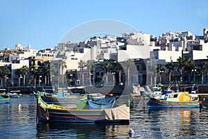 Luzzu boats moored in Marsascala Bay, Maltaa