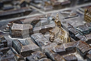 Lviv city in steel miniature. Old monument castle and church miniature
