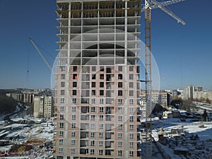 Lviv, Sychiv, Ukraine - 2 7 2020: Tower cranes work during the construction of a multi-story building. New apartments