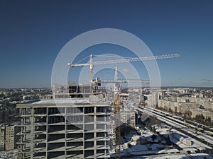 Lviv, Sychiv, Ukraine - 2 7 2020: Tower cranes work during the construction of a multi-story building. New apartments