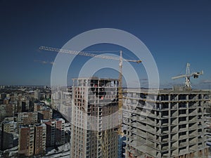 Lviv, Sychiv, Ukraine - 2 7 2020: Tower cranes work during the construction of a multi-story building. New apartments