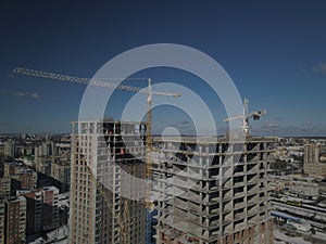 Lviv, Sychiv, Ukraine - 2 7 2020: Tower cranes work during the construction of a multi-story building. New apartments