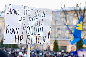 Lviv, Ukraine - December 8, 2013: Protesters with signs and national ukrainian flags during Revolution of Dignity