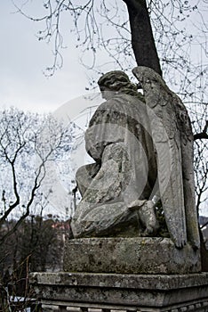 LVIV, UKRAINE - JANUARY 6, 2014: An old monument of angel at Lychakiv cemetery