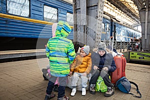 Ukrainian refugees from Mariupol on Lviv railway station waiting for train to escape to Europe
