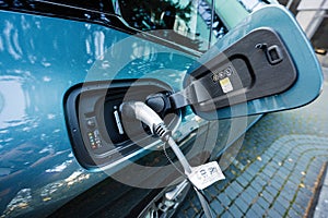 Lviv, Ukraine - October 09, 2022: BMW iX on charging station. Car is a battery electric mid size luxury crossover SUV