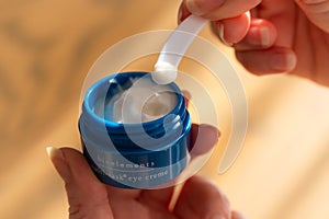 Bioelements Multi-Task Eye Creme container in hands