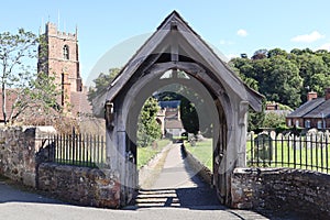 The lych gate of St George priory church in Dunster, Somerset. It marks the start of consecrated ground and traditionally pall
