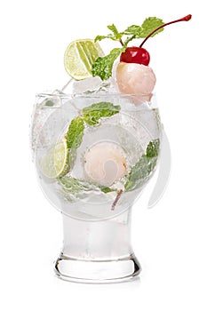 Lychee cocktail with mint leaves, lime and cherry decoration in white background