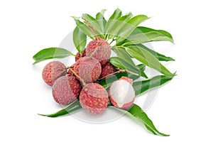 Lychee fruit with leaf, peeled to show the flesh white on white background.