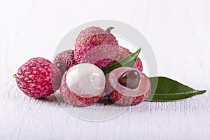 Lychee fruit on wooden background