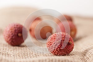 Lychee fruits on sackcloth studio shot